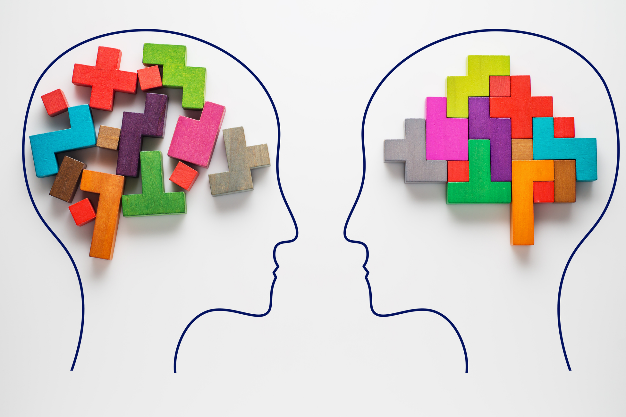 2 silhouettes outlines and colorful block pieces of different shapes located where their brains would be